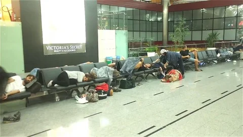 Passengers wait for their flight Stock Footage 83503622