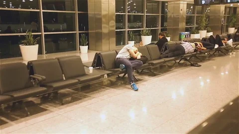 Passengers wait for their flight in one of the terminals Stock Footage 83503619