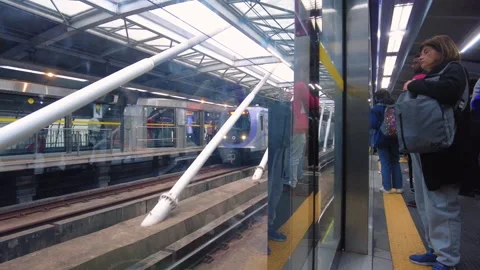 Passengers wait for the train to arrive at the Santo Amaro subway station 스톡 동영상 245595854