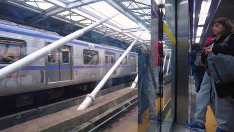 Passengers wait for the train to arrive at the Santo Amaro subway station Stock Footage 247805105