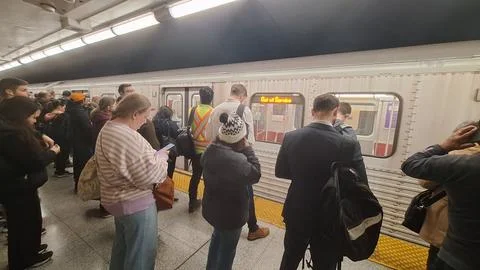 Passengers wait as the TTC subway train is delayed. Stock Photos
