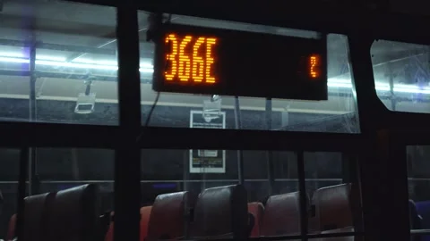 Passengers waiting for the BMTC bus and getting in at night Stock Footage 246992349
