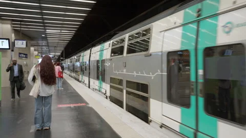 Passengers waiting for an electric train arrival at Paris subway station Stock Footage 336723043
