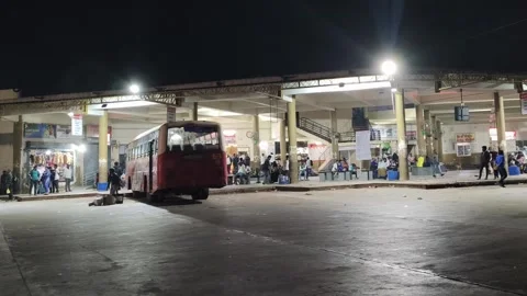Passengers Waiting at Local Bus Stand at Night in Small Town India Stock Footage 325291767