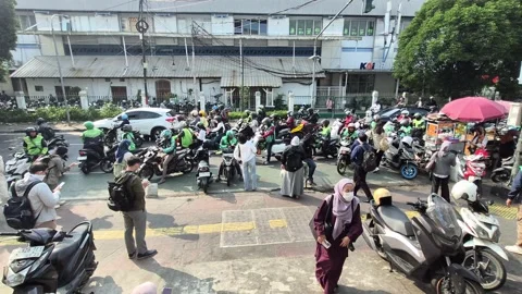 Passengers waiting for online motorcycle Stock Footage 345944034