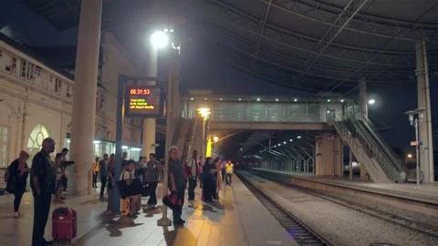 Passengers waiting for the train to enter the station at night, Malaysia Stock Footage 134746540