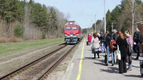 Passengers waiting for the train standing on the platform. Stock Footage 188840233