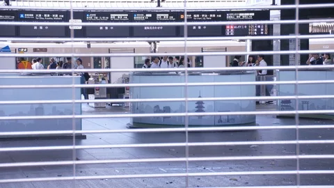 Passengers Walk in Background of Closed Kyoto Station Stock Footage 100577419