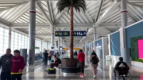Passengers walk at the gates section of AIFA airport, Mexico City, Mexico 4K Stock Footage 299455803