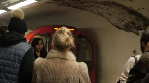 Passengers Walk On The Platform While Train Arrives To Station in London Tube HD Stock Footage 131172993