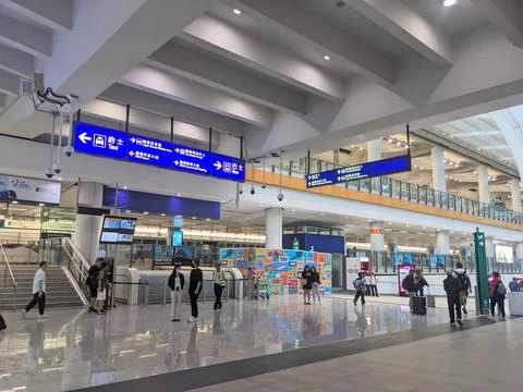 Passengers walk through the modern, spacious arrivals hall of Hong Kong Stock Photos