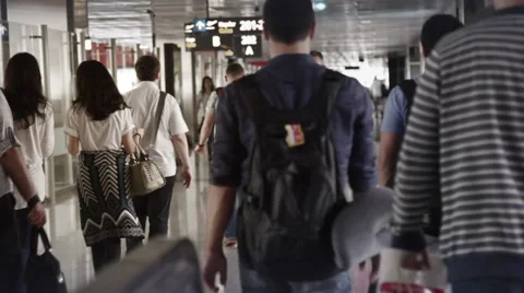 Passengers Walking between Gates inside an Airport Stock Footage 68983938