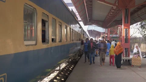 Passengers walking down a platform and boarding a train before it departs Stock Footage 153123471