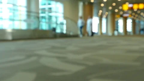 Passengers walking inside the air terminal Stock Footage 75986697