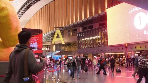 Passengers walking inside Doha Airport - Qatar Stock Footage 73354821