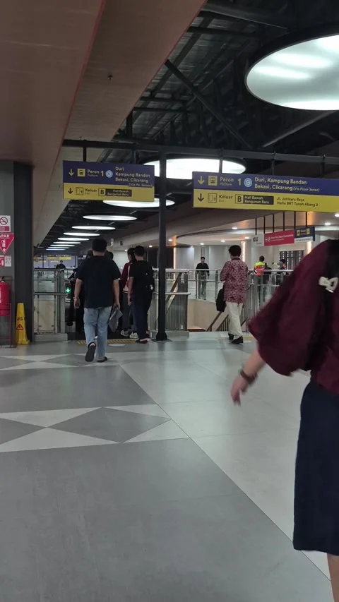 Passengers walking inside modern train station hall Stock Footage 345851453