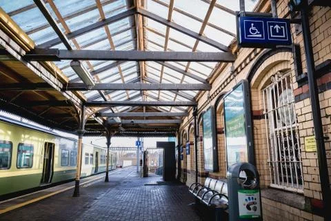 Passengers walking on the platform of the Howth Binn Eadair DART train statio Stock Photos