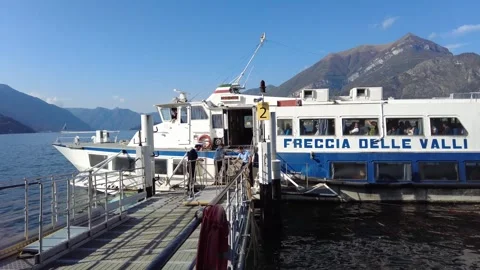 Passengers walking on ramp to ferry boat at Bellagio. Stock Footage 255885230
