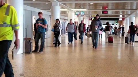 Passengers Walking Through Airport Stock Footage 76319478
