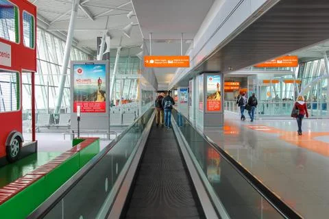 Passengers walking through arrival area of Warsaw Chopin Airport, Poland Stock Photos