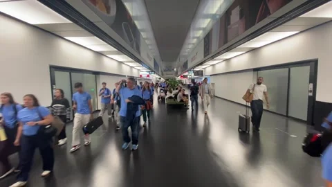 Passengers Walking Through Jet Bridge Tube Vienna Airport VIE - June 27 2026 Stock-Footage 337877289