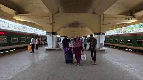 Passengers Walking Toward Exit at Railway Station Between Intercity Trains Stock Footage 341641188