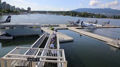 Passengers walking towards a seaplane Stock Footage 41116400