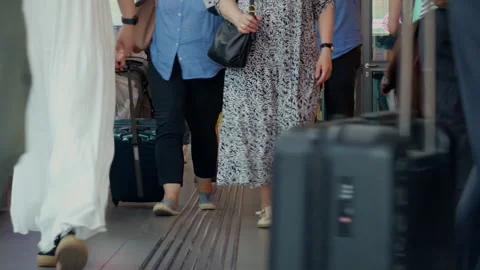 Passengers Walking on Train Platform Pulling Rolling Luggage, Low Angle Shot Video stock 337726022