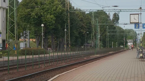 Passengers walking at the train station. 4K clip. Stock Footage 129231824