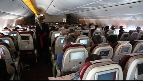 Passengers watch TV with computer games in jet cabin FULL HD 1080P Stock Footage