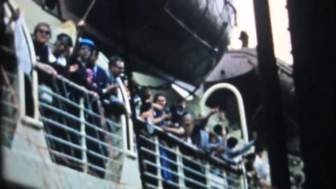 Passengers wave from railing of cruise ship 1950s vintage film home movie 4267 Stock Footage 79735940