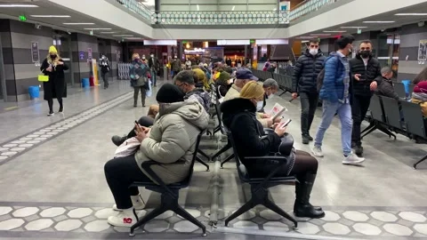 Passengers wearing masks wait for a ferry boat in a port of Istanbul, Turkey 4K Stock Footage 166321802