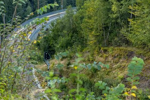 Passengers were late for the train which left on the rails over the bridge .. Stock Photos