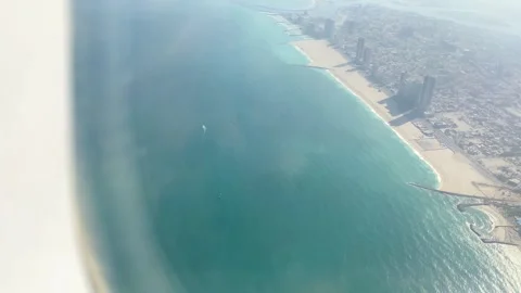 Passengers window Aerial point of view Abu Dhabis sunlit sandy beach coastl.. Stock Footage 308647211