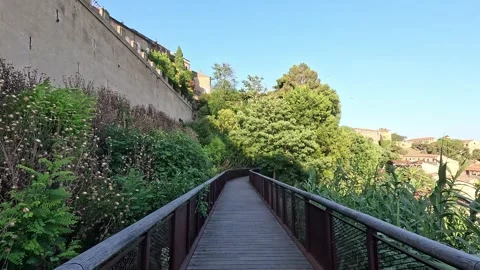 Passerelle Cardinal Pierre de Bonsi, Elevated wooden walkway along the ramparts Stock Footage 344531056