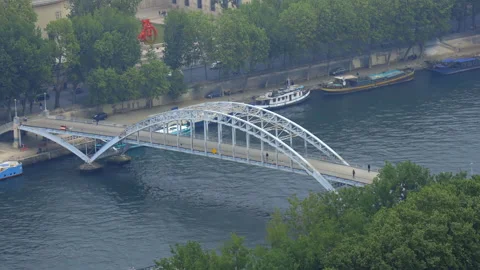 The Passerelle Debilly, a through arch bridge on the river Seine in Paris Stock Footage 200154991