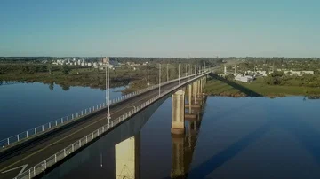Passing above large bridge iver river Stock Footage 85541953