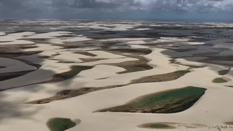 Passing Across Interlaced Lagoons and White Dunes at Lençóis Maranhenses Stock Footage 342441148