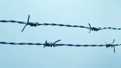 Passing Barbed Wire On Cloudy Day Stockbeeldmateriaal 143746102