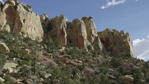 Passing beautiful Escalante mountainside with ample plant life, slow motion 스톡 동영상 248577140