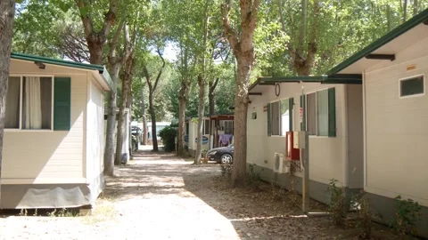 Passing Between the Rows of Bungalows of a European Campsite Stock Footage 245429393