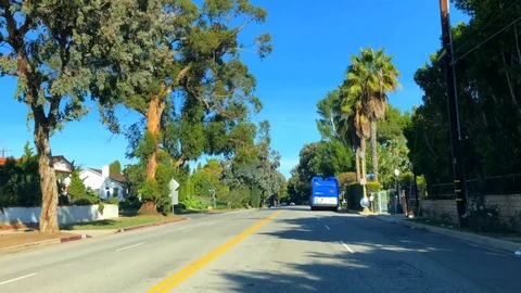 Passing a Blue Bus on Sunset Blvd. Stock Footage 102242593