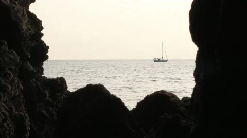 Passing boats seen from a cave Stock Footage 51021055