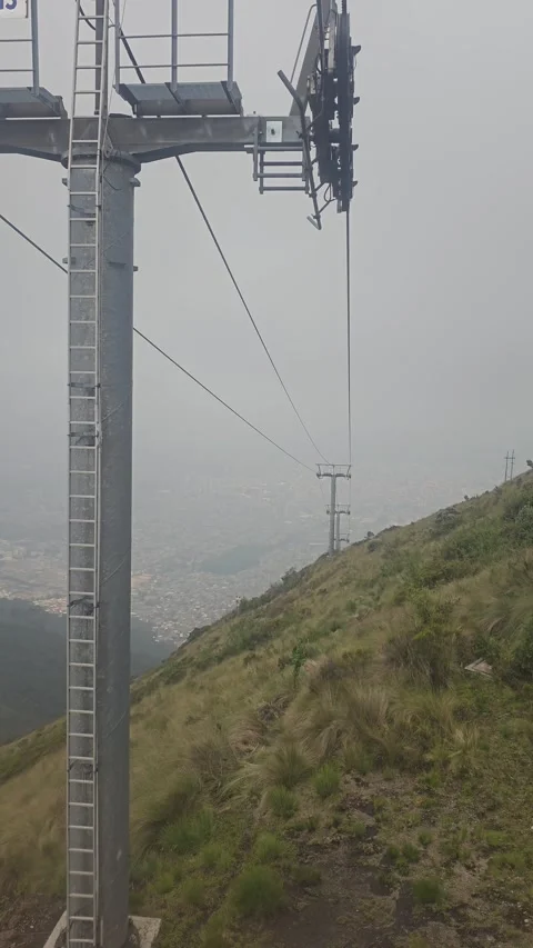 Passing Cable Car Pylon over Misty Slope,, Teleférico Quito, Ecuador – Vertical Stock Footage 331494325