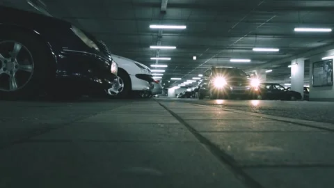 Passing car and a man walking by mall parking lot Stock Footage 136926749