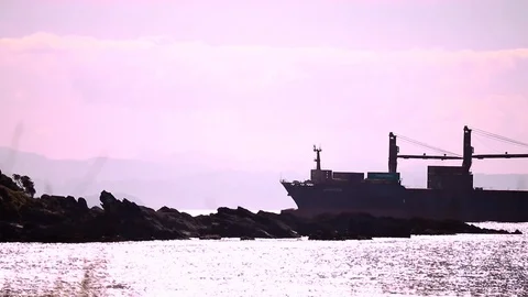 Passing Cargo Ship Silhouette Stock Footage 124354448