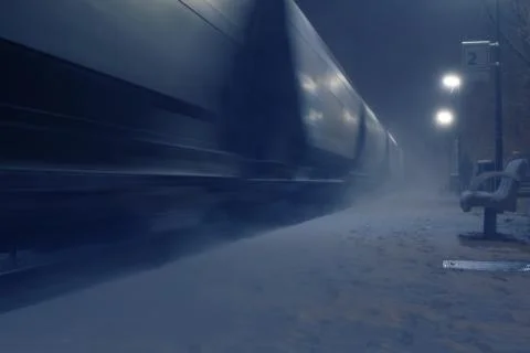 Passing cargo train in blurred motion at train station on a winter night Stock Photos
