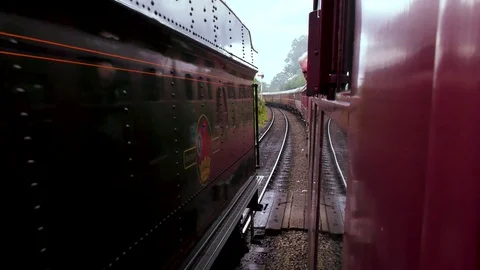 Passing classic steam trains with passengers Stock Footage 80306896