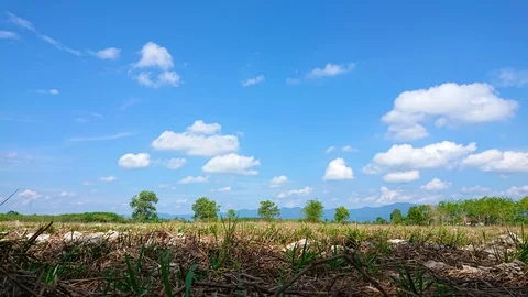Passing cloud with blue sky over field. Stock Footage 108301949
