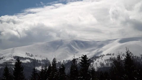Passing Clouds Cast Shadows On Snow Capped carpathian mountains time lapse Stock Footage 87828174